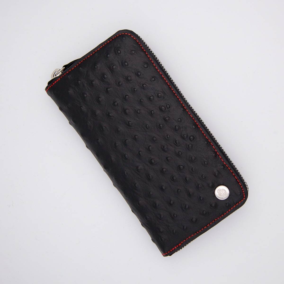 Compagnon zippé en cuir façon autruche noir rouge .