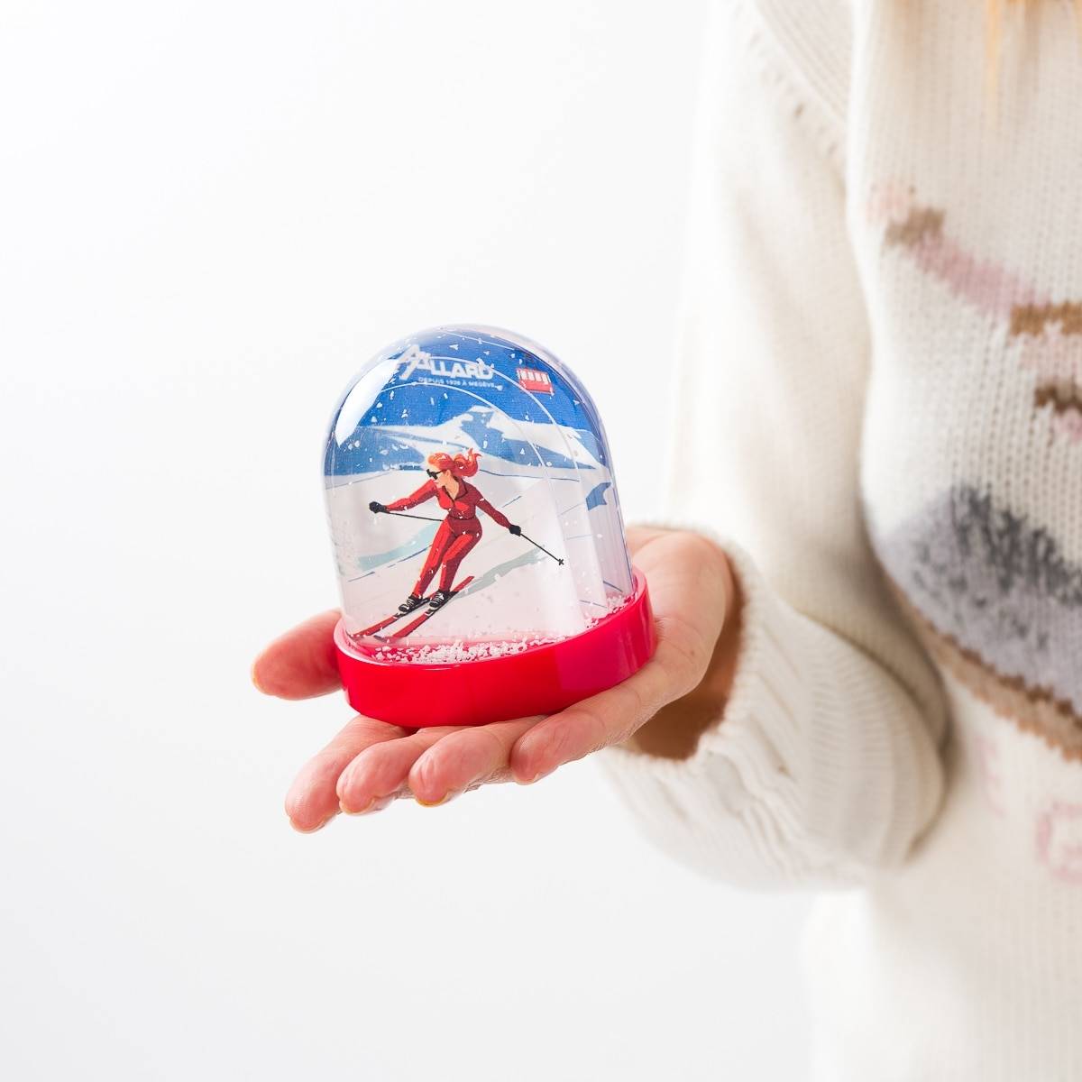 Boule à neige skieuse fuseau rouge